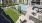 A community outdoor recreational area with pool, putting green, and seating