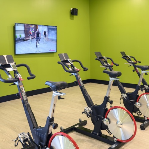 Access to resident-only features Stationary bikes in a fitness room