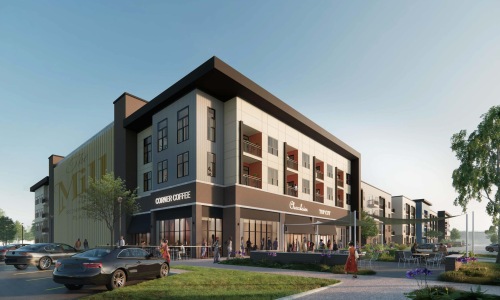 exterior of building with green turf and some seating