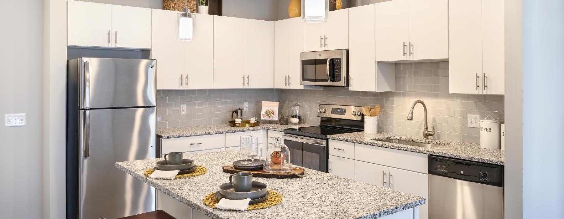 a kitchen with white cabinets